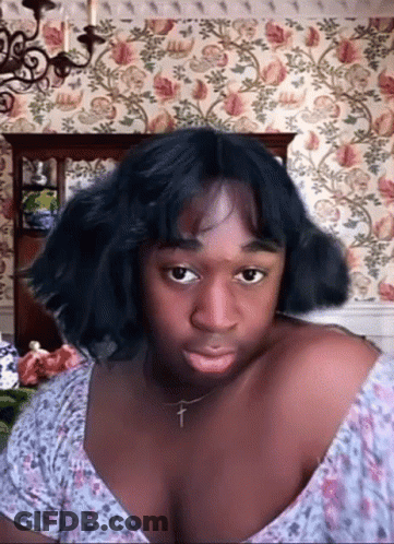Woman With Cross Necklace Making Funny Face GIF
