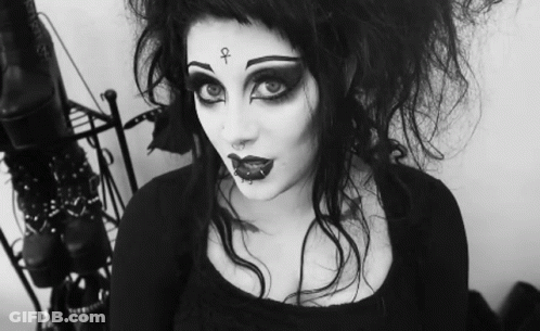 Woman With Cross On Face GIF