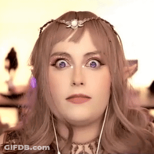 Woman With Crown And Earphones Making Funny Face GIF
