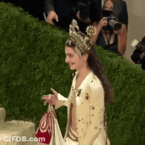 Woman With Crown Holding Bag GIF