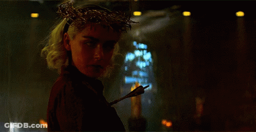 Woman With Crown Of Thorns Holding Arrow GIF