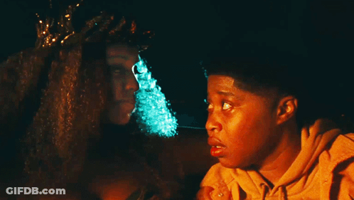 Woman With Crown Sits Next To Boy GIF