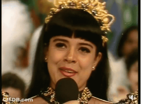Woman With Crown Speaking Into Microphone GIF