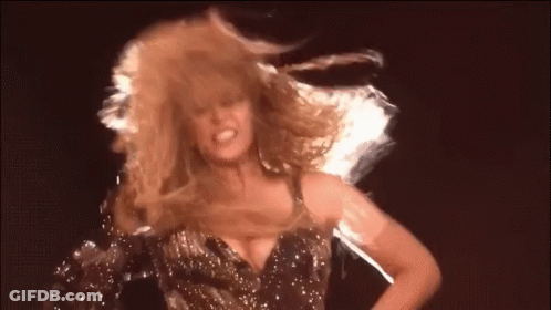 Woman With Curly Blonde Hair Dancing GIF