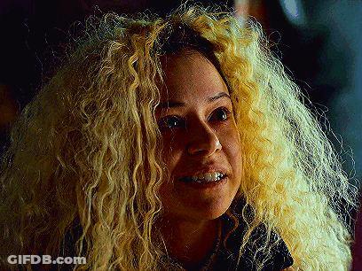 Woman With Curly Blonde Hair Smiling GIF
