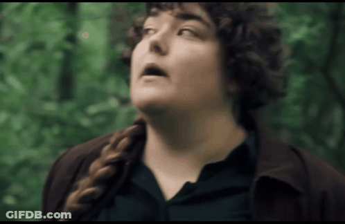 Woman With Curly Hair And Braid Looking Up At Sky GIF