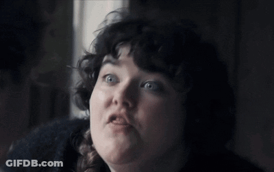 Woman With Curly Hair And Braid Looking Up At Sky GIF