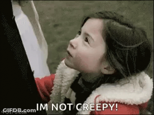 Woman With Curly Hair And Chest Tattoo GIF