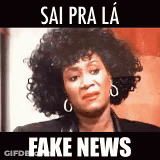 Woman With Curly Hair And Earrings Making Funny Face GIF
