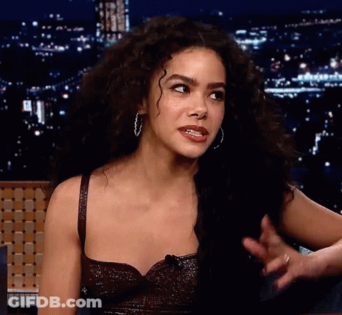 Woman With Curly Hair And Hoop Earrings GIF