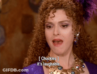 Woman With Curly Hair And Necklace Chuckles It's Laughable GIF