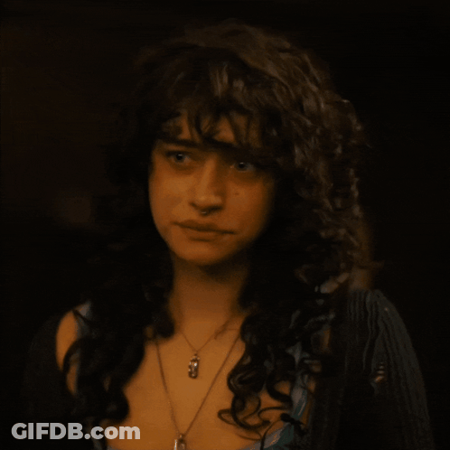 Woman With Curly Hair And Pendant Necklace GIF