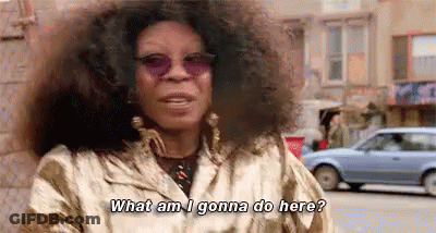Woman With Curly Hair And Sunglasses Talking GIF