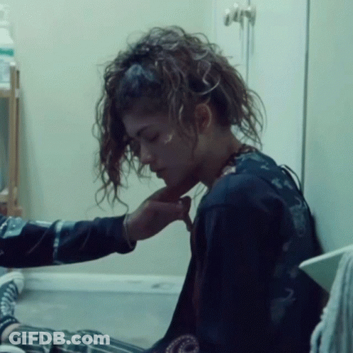 Woman With Curly Hair Comforted GIF