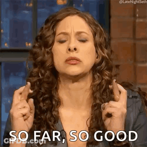 Woman With Curly Hair Crossing Fingers GIF