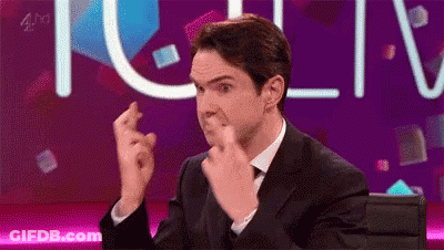 Woman With Curly Hair Crossing Fingers Making Please Sign GIF