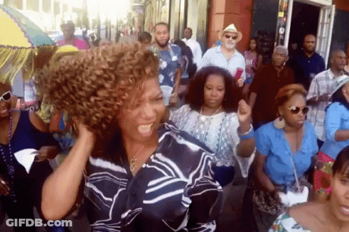 Woman With Curly Hair Dancing In Crowd GIF