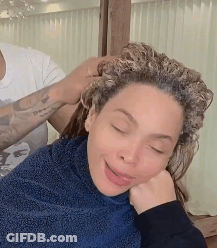 Woman With Curly Hair Getting Hair Dyed GIF