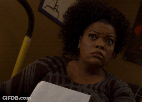 Woman With Curly Hair Holding Paper GIF