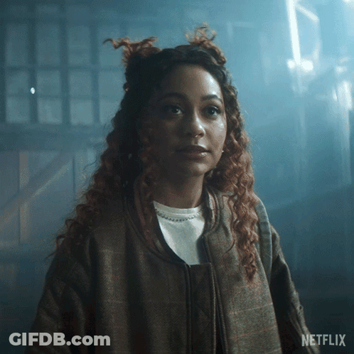 Woman With Curly Hair In Dark Room Netflix GIF