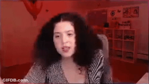 Woman With Curly Hair In Front Of Red Background GIF
