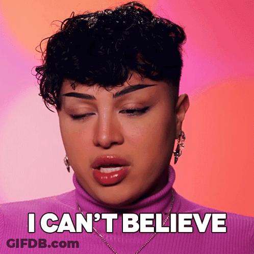 Woman With Curly Hair In Purple Turtleneck GIF