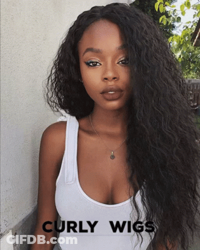 Woman With Curly Hair In White Tank Top And Necklace GIF