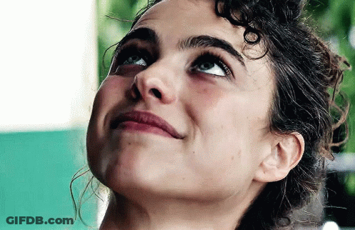 Woman With Curly Hair Looking Up GIF