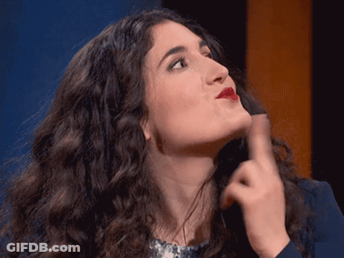 Woman With Curly Hair Making Face With Hand GIF