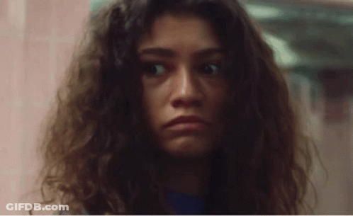 Woman With Curly Hair Making Funny Face GIF