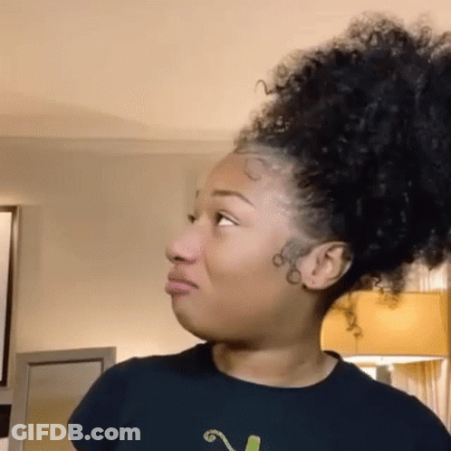 Woman With Curly Hair Making Funny Face GIF