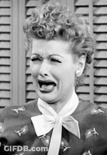 Woman With Curly Hair Making Funny Face GIF