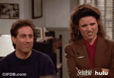 Woman With Curly Hair Necklace Says Chuckles Laughable GIF