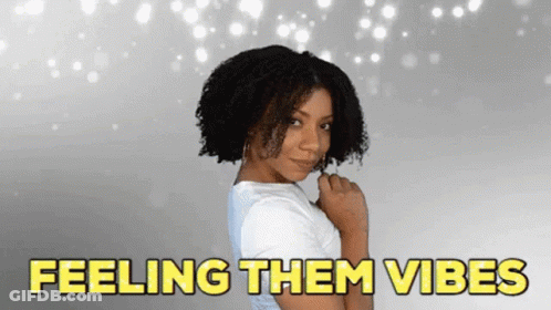 Woman With Curly Hair Saying Feeling Them Vibes GIF