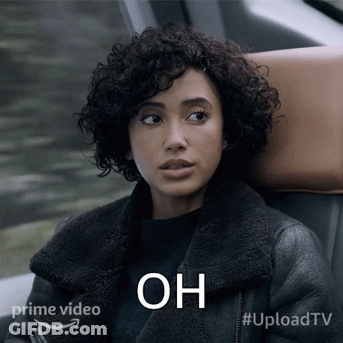 Woman With Curly Hair Sitting In Car Saying Oh GIF