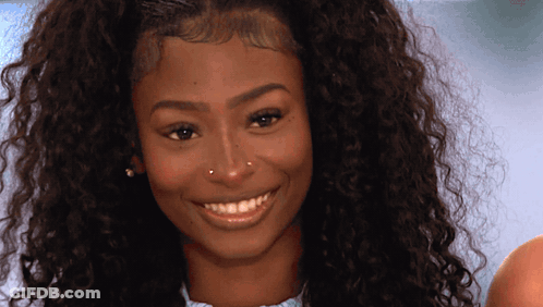 Woman With Curly Hair Smiling And Nose Ring GIF