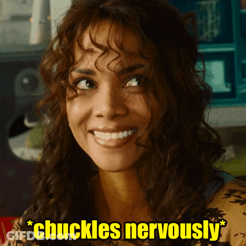 Woman With Curly Hair Smiling With Words Chuckles Nervously GIF