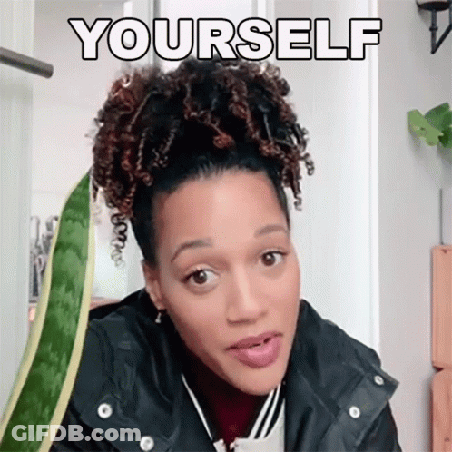 Woman With Curly Hair Standing In Front Of Plant Yourself GIF
