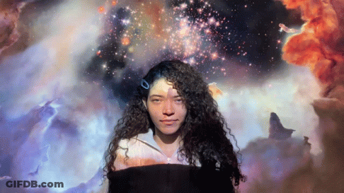 Woman With Curly Hair Surrounded By Purple Light GIF