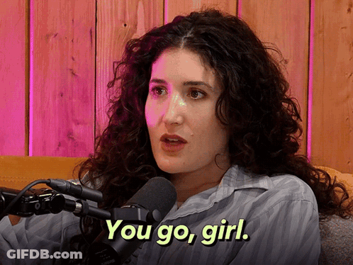 Woman With Curly Hair Talking Into Microphone GIF