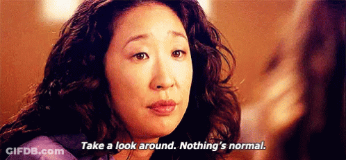 Woman With Curly Hair Talking To Another Woman Says Take A Look Around Nothing's Normal GIF