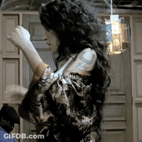 Woman With Curly Hair Tattoo Saying I Love You GIF