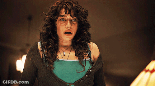 Woman With Curly Hair Wearing A Necklace Saying A GIF