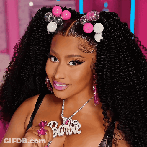 Woman With Curly Hair Wearing Barbie Necklace GIF