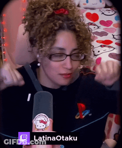 Woman With Curly Hair Wearing Glasses And Hello Kitty Sticker GIF