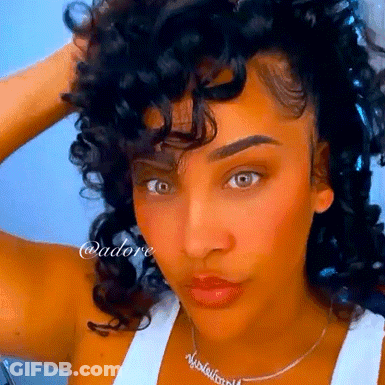 Woman With Curly Hair Wearing Necklace Saying Nicole Williams GIF
