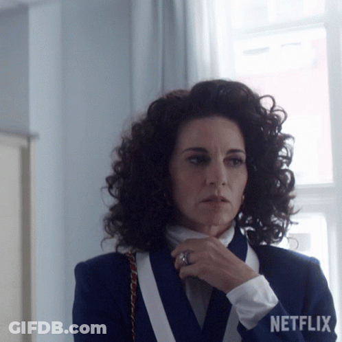 Woman With Curly Hair Wearing Netflix Logo Jacket GIF