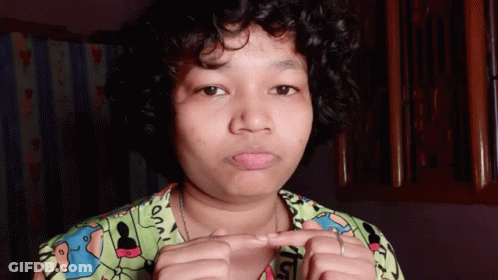 Woman With Curly Hair Wearing Snoopy Shirt GIF