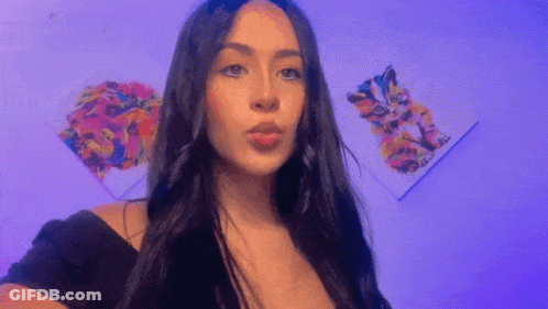 Woman With Dark Hair Before Purple Cat Painting GIF