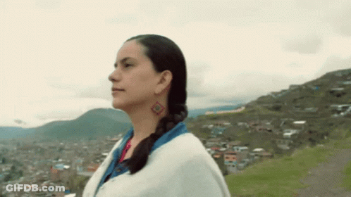 Woman With Diamond Earring Before Mountain GIF